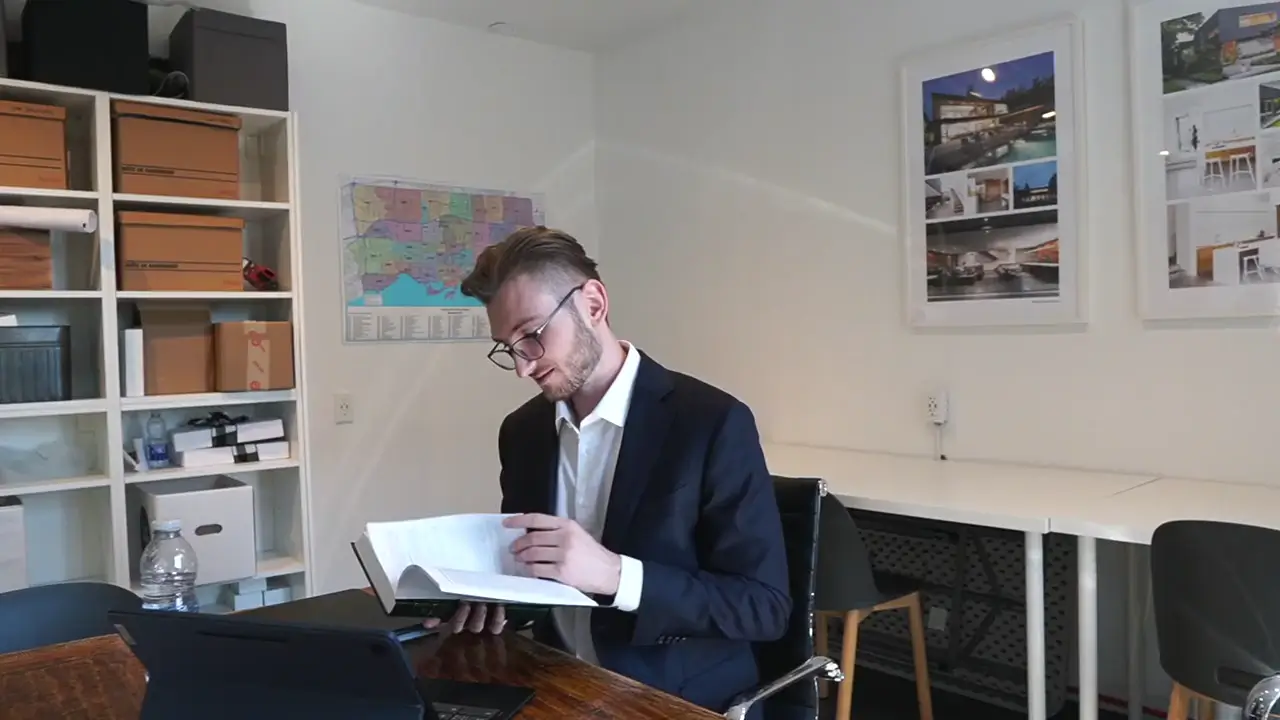 A buyer reviewing documents at a desk